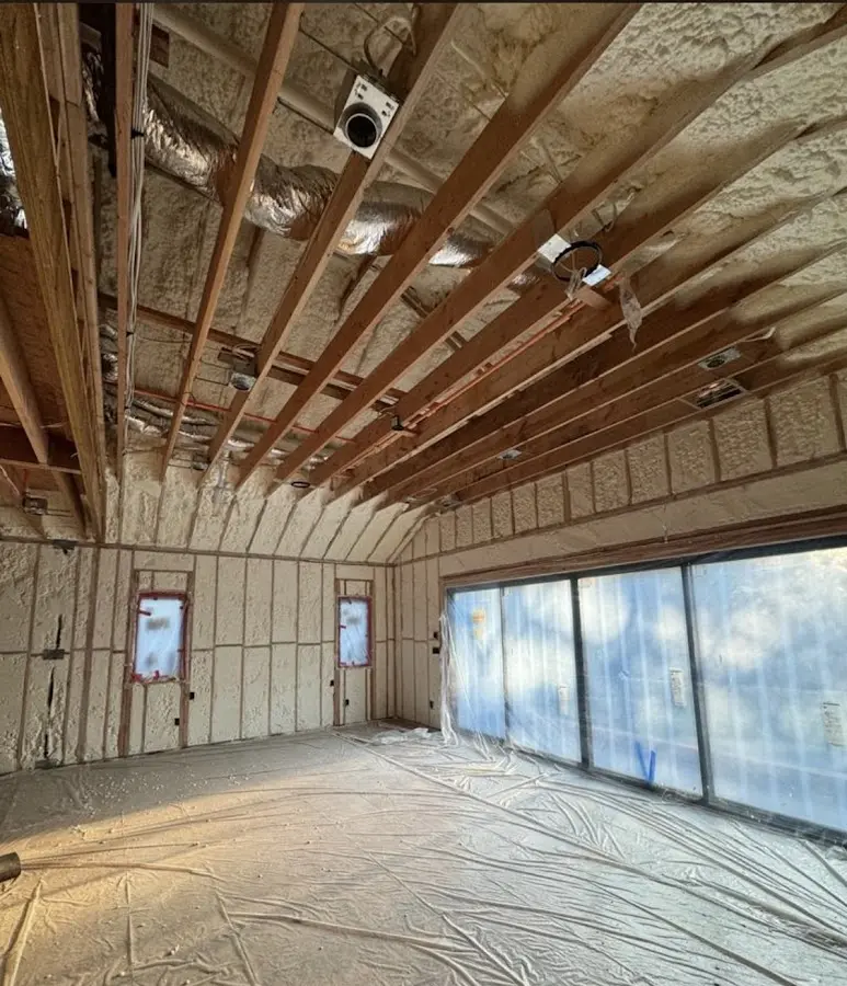 Interior walls and ceiling insulated with spray foam during new construction in Covington